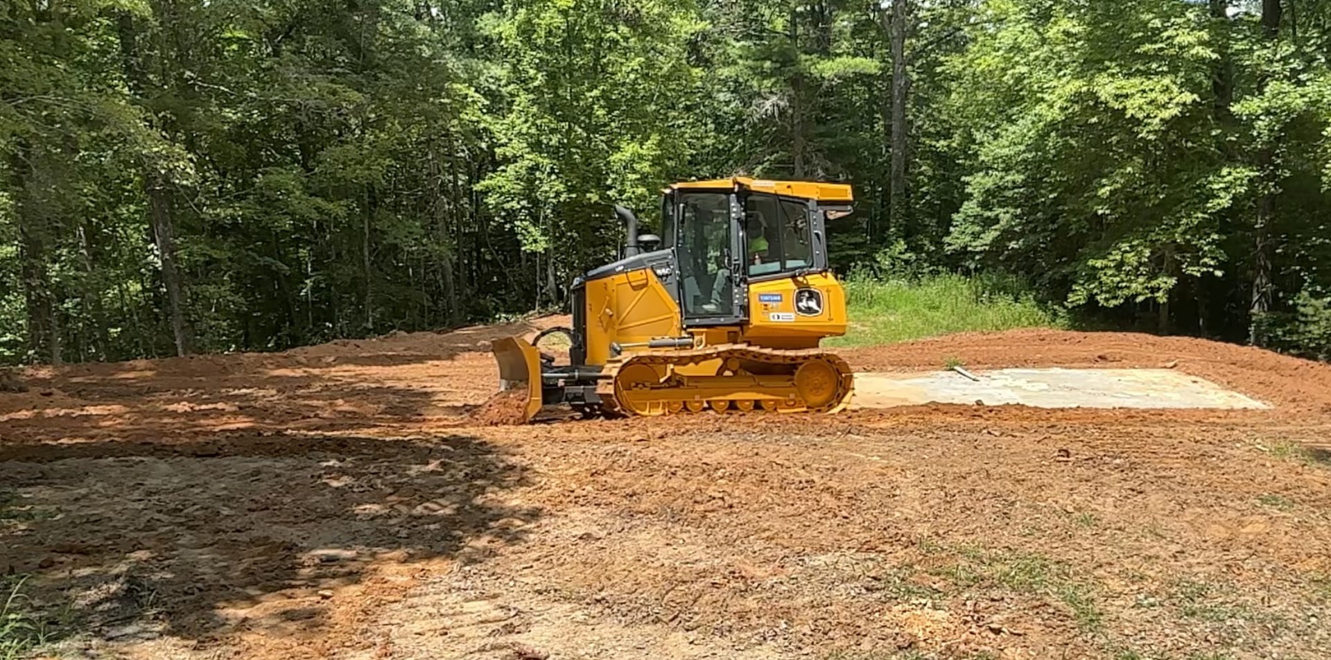 Bobcat clearing land