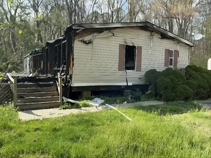 Fire-damaged mobile home before demolition by R&G Land Clearing