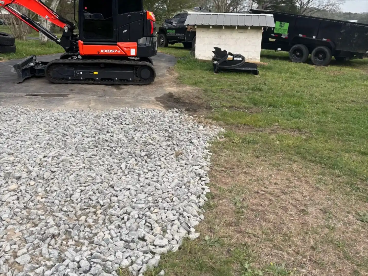 Excavator beside a fresh gravel pad, R&G Land Clearing