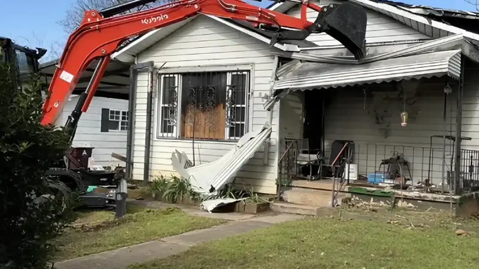 R&G Land Clearing's Kubota excavator tearing down a house