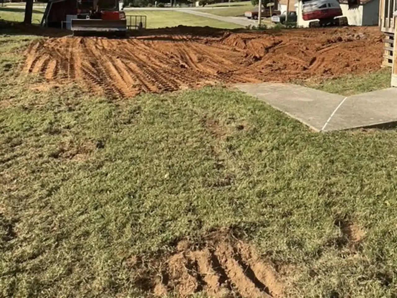 Two excavators grading compacted fill where the pool used to be, R&G Land Clearing